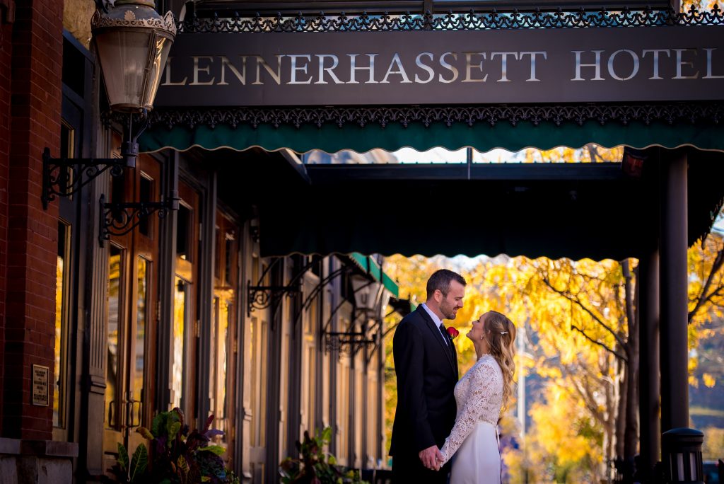 A newlywed couple exchanging looks under the Blennerhassett awning